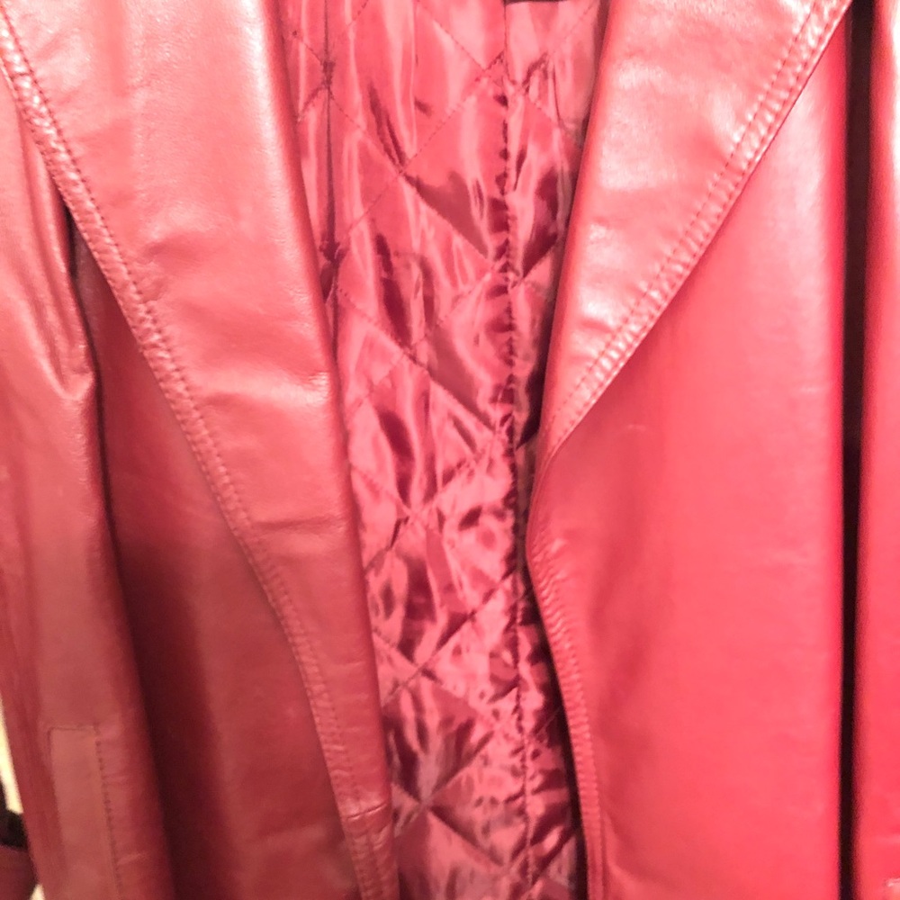 This is a 3/4 length red  genuine leather jacket, worn only a few times.